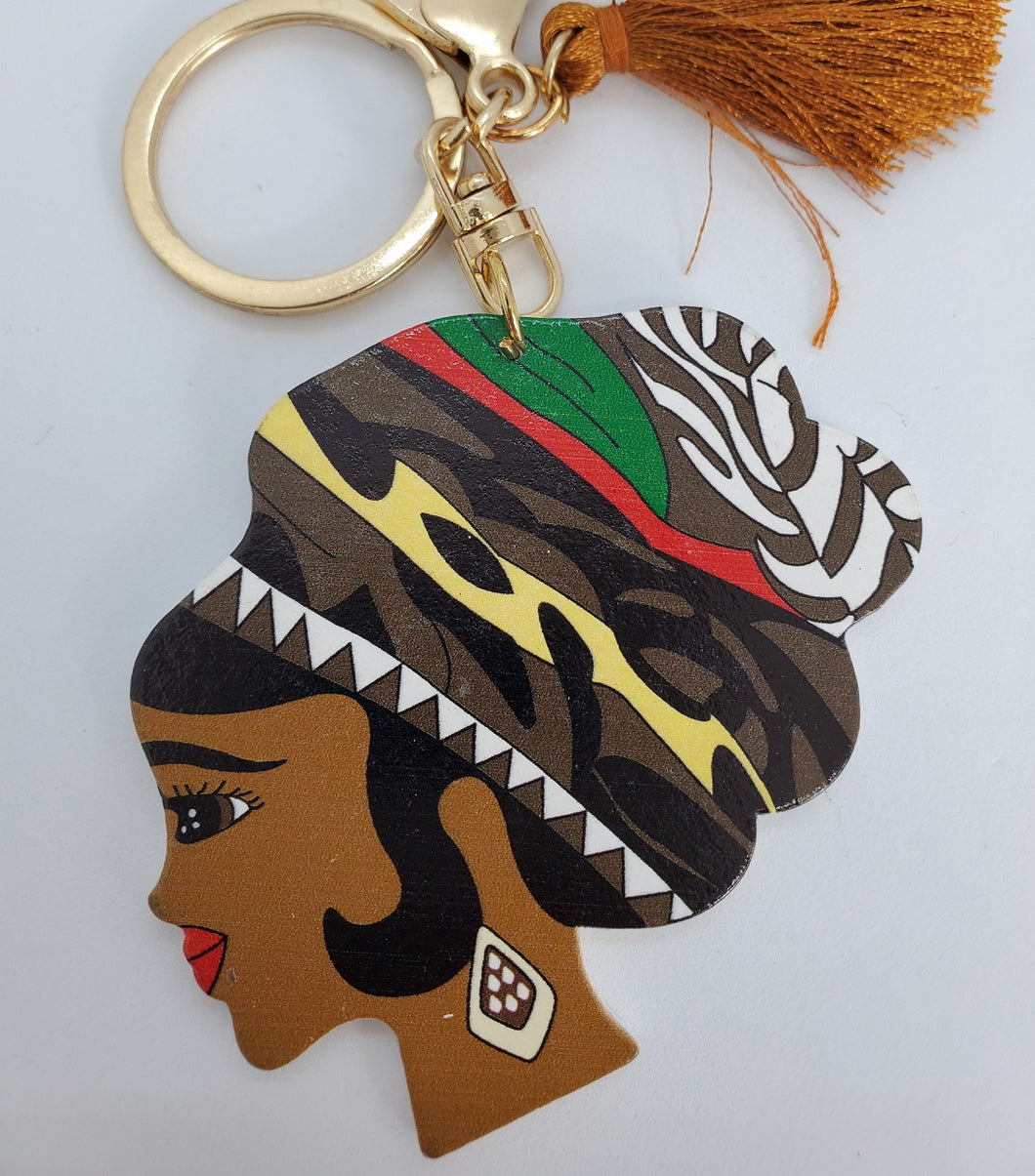 Gold Keychain with Black Girl in Multi Colored Wool Hat and Brown Tassel